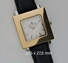 Square watch's front  with silver colour case and gold colour front 27,5 x 27,5 mm.